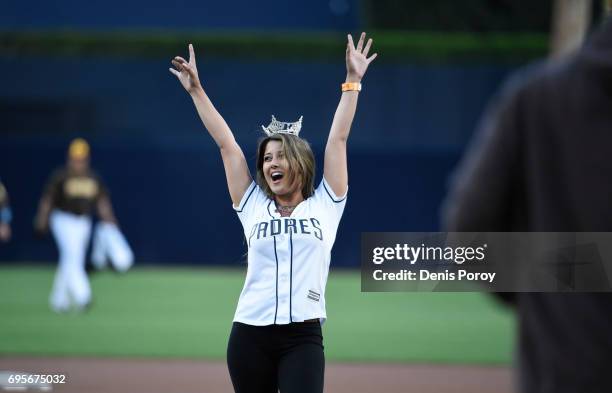 Miss California Jessa Carmack throws out the first pitch before a baseball game between the San Diego Padres and the Kansas City Royals at PETCO Park...