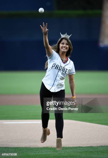 Miss California Jessa Carmack throws out the first pitch before a baseball game between the San Diego Padres and the Kansas City Royals at PETCO Park...