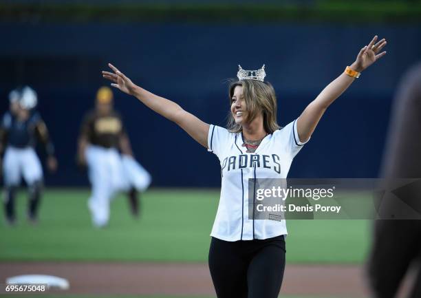 Miss California Jessa Carmack throws out the first pitch before a baseball game between the San Diego Padres and the Kansas City Royals at PETCO Park...