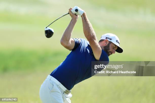 Dustin Johnson of the United States plays his shot from the first tee during a practice round prior to the 2017 U.S. Open at Erin Hills on June 13,...