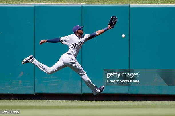 Lewis Brinson of the Milwaukee Brewers is unable to make a catch during the fifth inning resulting in a double for Matt Carpenter of the St. Louis...