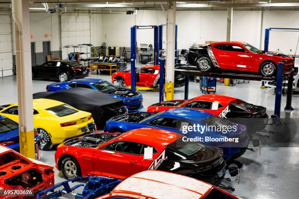 General Motors Co. Chevrolet COPO Camaro performance vehicles sit inside the company's build center in Oxford, Michigan, U.S., on Friday, April 21,...
