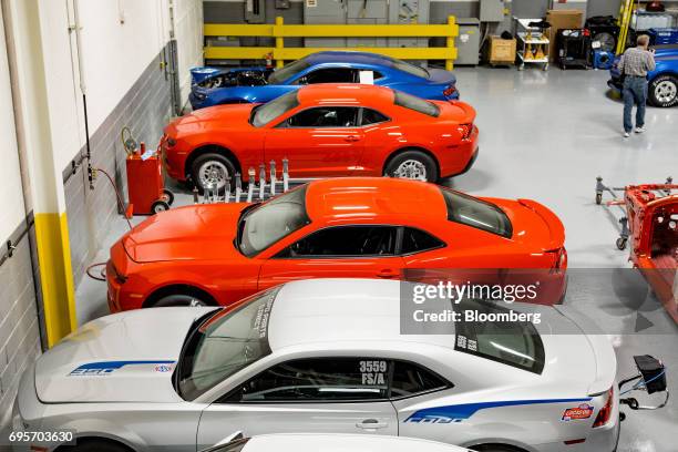 General Motors Co. Chevrolet COPO Camaro performance vehicles sit inside the company's build center in Oxford, Michigan, U.S., on Friday, April 21,...