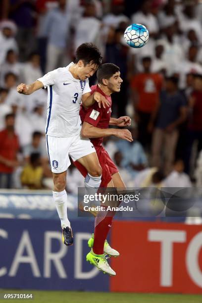 Karim Boudiaf of Qatar vies for the ball against Kim Jin-Su of South Korea during the 2018 FIFA World Cup Asian Qualifying group A football match...