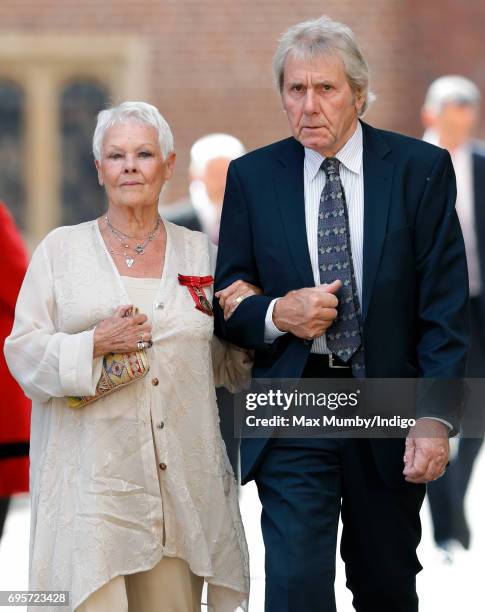 Dame Judi Dench and David Mills arrive to attend Evensong at the Chapel Royal Hampton Court Palace, to celebrate the Centenary of the founding of the...