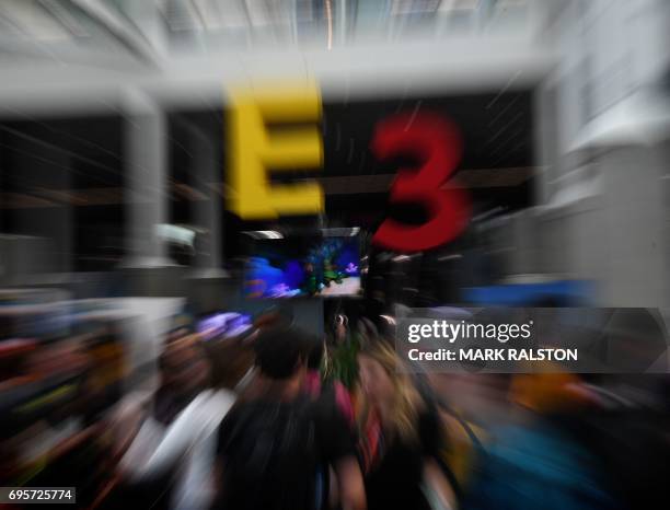 Crowds wait to enter the Los Angeles Convention center on day one of E3 2017, the three day Electronic Entertainment Expo, one of the biggest events...