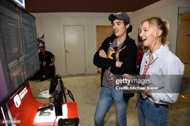 Actress Audrey Whitby and actor Joey Bragg play Super Mario Odyssey at the Nintendo booth at the 2017 E3 Gaming Convention at Los Angeles Convention...