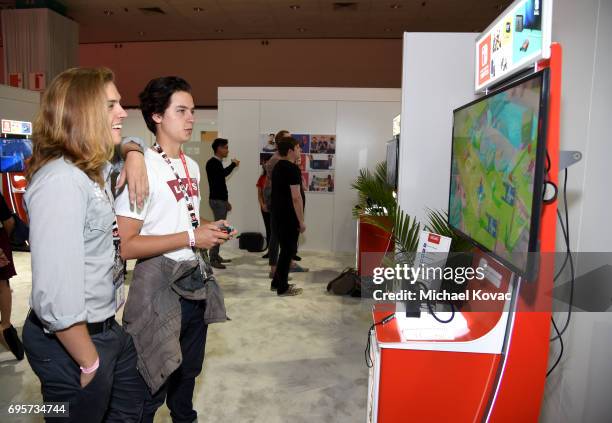 Dylan Sprouse and Cole Sprouse play Mario + Rabbids Kingdom Battle the Nintendo booth at the 2017 E3 Gaming Convention at Los Angeles Convention...