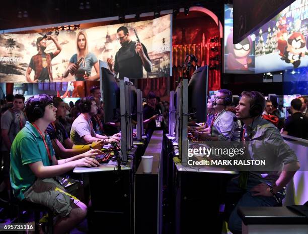 Gamers play the Ubisoft "Rainbow Siege" game at the Los Angeles Convention center on day one of E3 2017, the three day Electronic Entertainment Expo,...