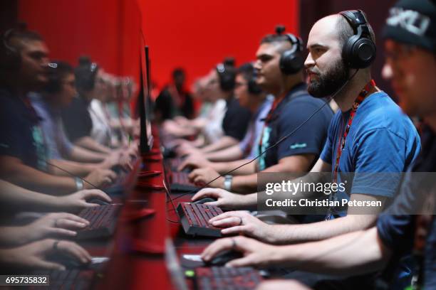 Gamers compete in PC gaming at the 'Nvidia' booth during the Electronic Entertainment Expo E3 at the Los Angeles Convention Center on June 13, 2017...