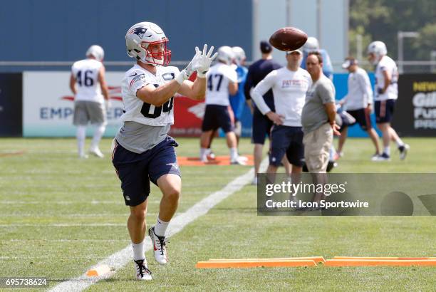 New England Patriots wide receiver Austin Carr eyes a catch during New England Patriots OTA on June 13 at the Patriots Practice Facility in...