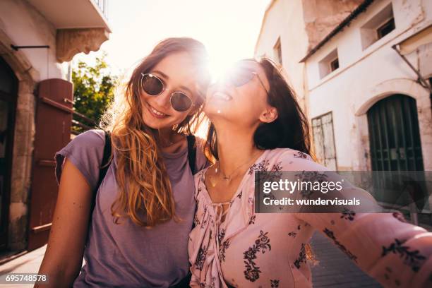 women on mediterranean vacations taking a selfie in a city - spain teen face imagens e fotografias de stock