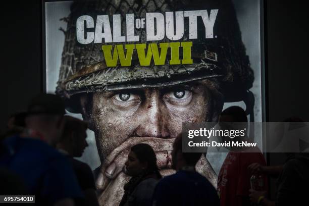 People wait in line of to see a demonstration Call of Duty WWII at the Activision exhibit on opening day of the Electronic Entertainment Expo at the...