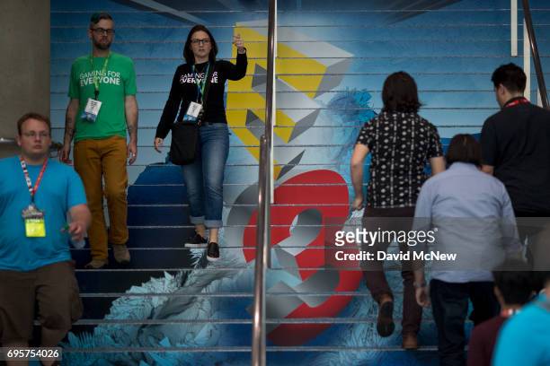 People attend opening day of the Electronic Entertainment Expo at the Los Angeles Convention Center on June 13, 2017 in Los Angeles, California. The...