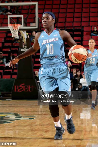 Matee Ajavon of the Atlanta Dream handles the ball against the Seattle Storm on June 13, 2017 at Allstate Arena in Seattle, Washington. NOTE TO USER:...