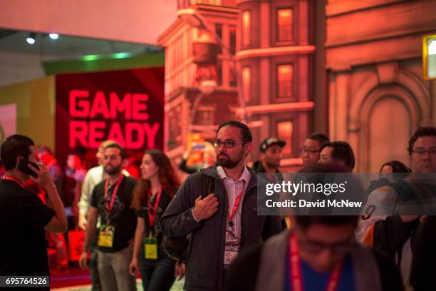People attend opening day of the Electronic Entertainment Expo at the Los Angeles Convention Center on June 13, 2017 in Los Angeles, California. The...