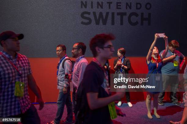 People attend the Nintendo area on opening day of the Electronic Entertainment Expo at the Los Angeles Convention Center on June 13, 2017 in Los...