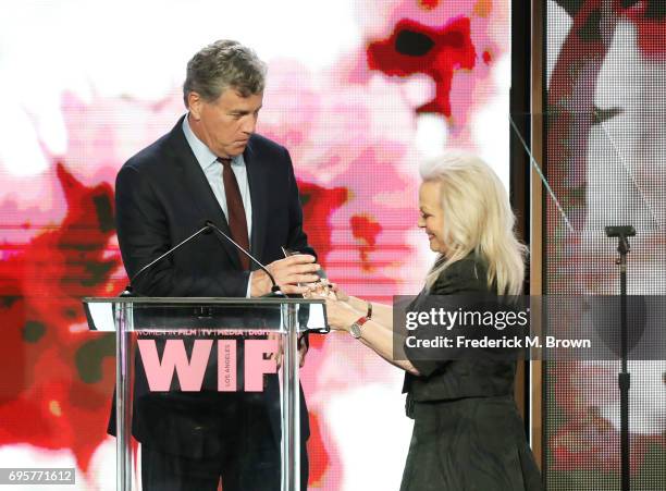 The Women In Film Beacon Award recipient and Co-President & Co-Founder of Sony Pictures Classics Tom Bernard, receives the award on stage from...