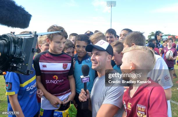 Channel 9 personality and former Rugby League player Beau Ryan chats with chidren at a Junior Rugby League Clinic during a Queensland Maroons State...