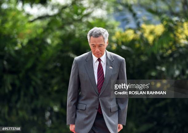 This photograph taken on June 2, 2017 shows Singapore prime minister Lee Hsien Loong at an event at the Istana presidential palace in Singapore. A...