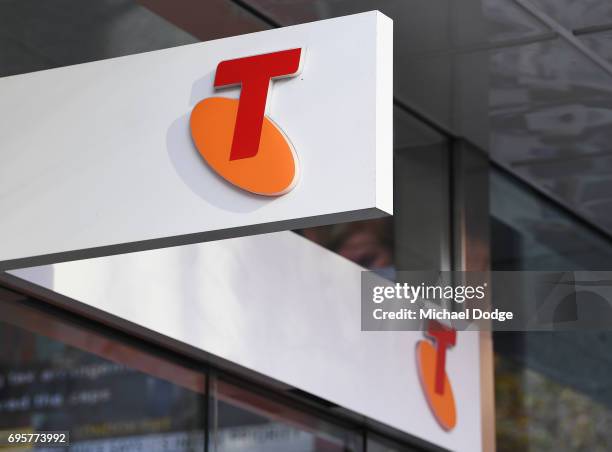 Telstra logo is seen outside the Telstra Melbourne headquarters on June 14, 2017 in Melbourne, Australia. Telecommunications company Telstra is...