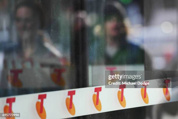 Telstra logos are seen outside the Telstra Melbourne headquarters on June 14, 2017 in Melbourne, Australia. Telecommunications company Telstra is...