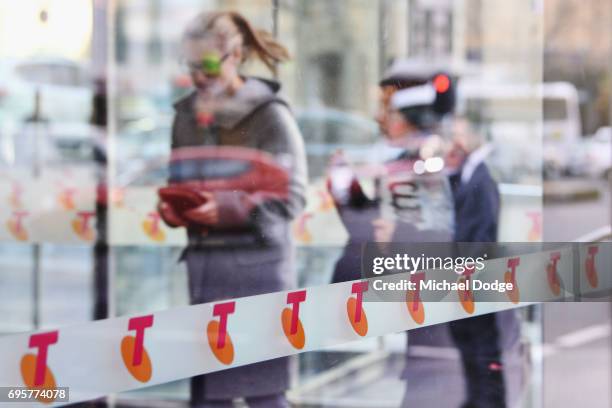 Telstra logos are seen outside the Telstra Melbourne headquarters on June 14, 2017 in Melbourne, Australia. Telecommunications company Telstra is...