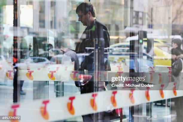 Telstra logos are seen outside the Telstra Melbourne headquarters on June 14, 2017 in Melbourne, Australia. Telecommunications company Telstra is...