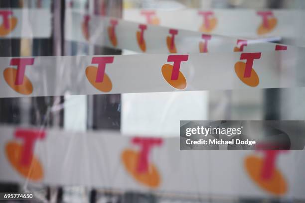 Telstra logos are seen outside the Telstra Melbourne headquarters on June 14, 2017 in Melbourne, Australia. Telecommunications company Telstra is...