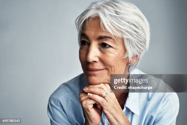 every minute of life is a precious moment - hand on chin stock pictures, royalty-free photos & images