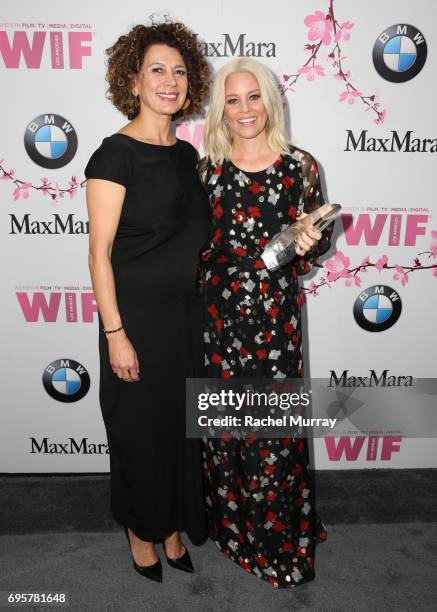 Chairman of Universal Pictures Donna Langley and actress and The Crystal Award for Excellence in Film Honoree Elizabeth Banks, wearing Max Mara,...