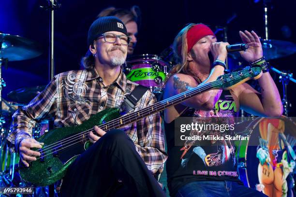 Bassist Bobby Dall and vocalist Bret Michaels of Poison perform at ORACLE Arena on June 13, 2017 in Oakland, California.