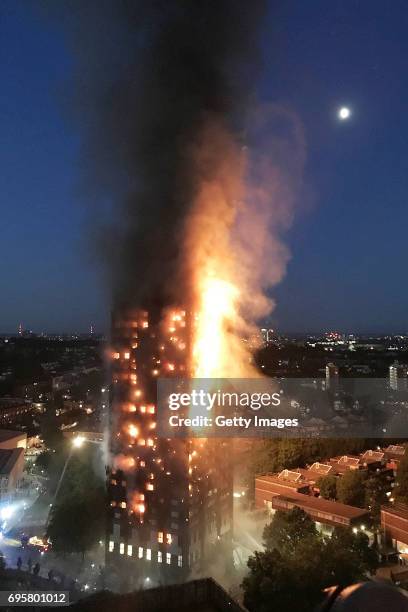 In this image taken by eyewitness Gurbuz Binici, a huge fire engulfs the 24 story Grenfell Tower in Latimer Road, West London in the early hours of...