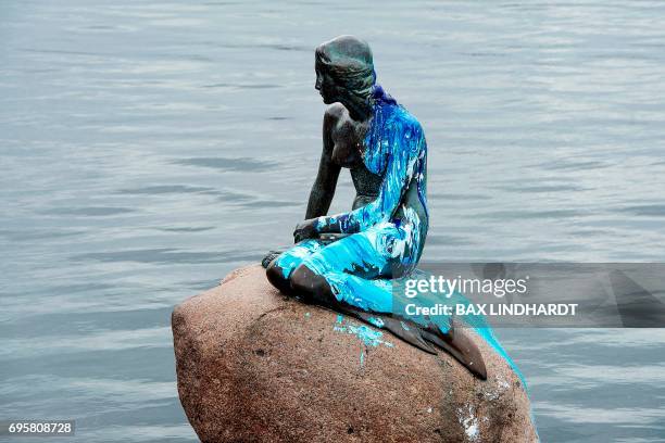 The Little Mermaid in Copenhagen is pictured on June 14, 2017 after the statue has been vandalized, . - Blue and white paint was poured over the...