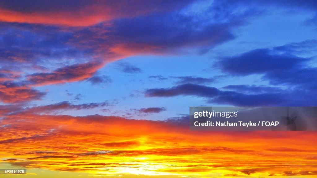 Full frame of orange clouds during sunset