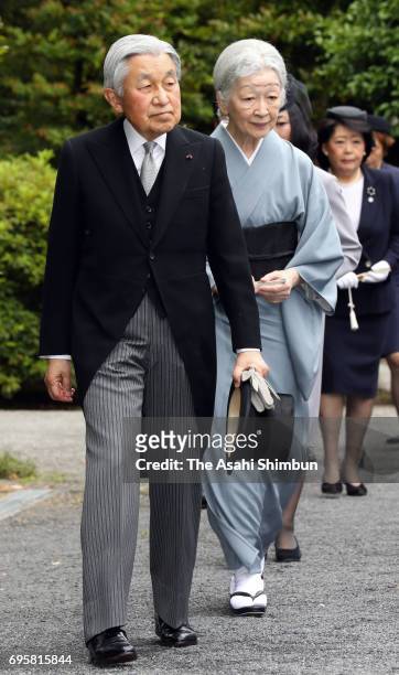 Emperor Akihito and Empress Michiko visit the grave of late Prince Tomohito of Mikasa at Toshimagaoka Cemetery on June 14, 2017 in Tokyo, Japan.