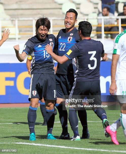 Yuya Osako of Japan celebrates scoring the opening goal with his team mates during the FIFA World Cup Russia Asian Final Qualifier match between Iraq...