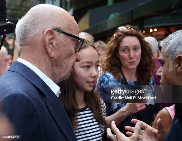 London Mayor Sadiq Khan speaks to Rupert Murdoch and his daughter Chloe Murdoch at Borough Market as it re-opens to the public following the...