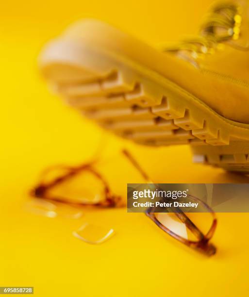 stepping on glasses - broken spectacles stock pictures, royalty-free photos & images