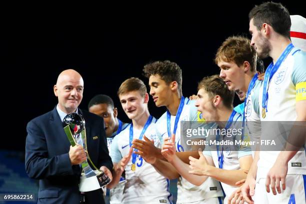 President Gianni Infantino awards England the winners trophy after the FIFA U-20 World Cup Korea Republic 2017 Final match against Venezuela at Suwon...