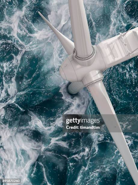 close up of a wind turbine in the sea - wind turbine aerial stock pictures, royalty-free photos & images