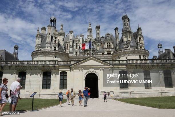 Picture taken on June 13 shows tourists visiting the Chateau de Chambord in Chambord.