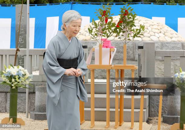 Empress Michikovisits the grave of late Prince Tomohito of Mikasa at Toshimagaoka Cemetery on June 14, 2017 in Tokyo, Japan.