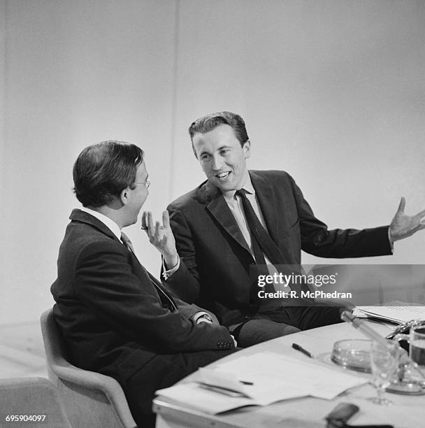 From left to right, British Conservative politician Norman St John-Stevas and broadcaster David Frost , 11th April 1965.