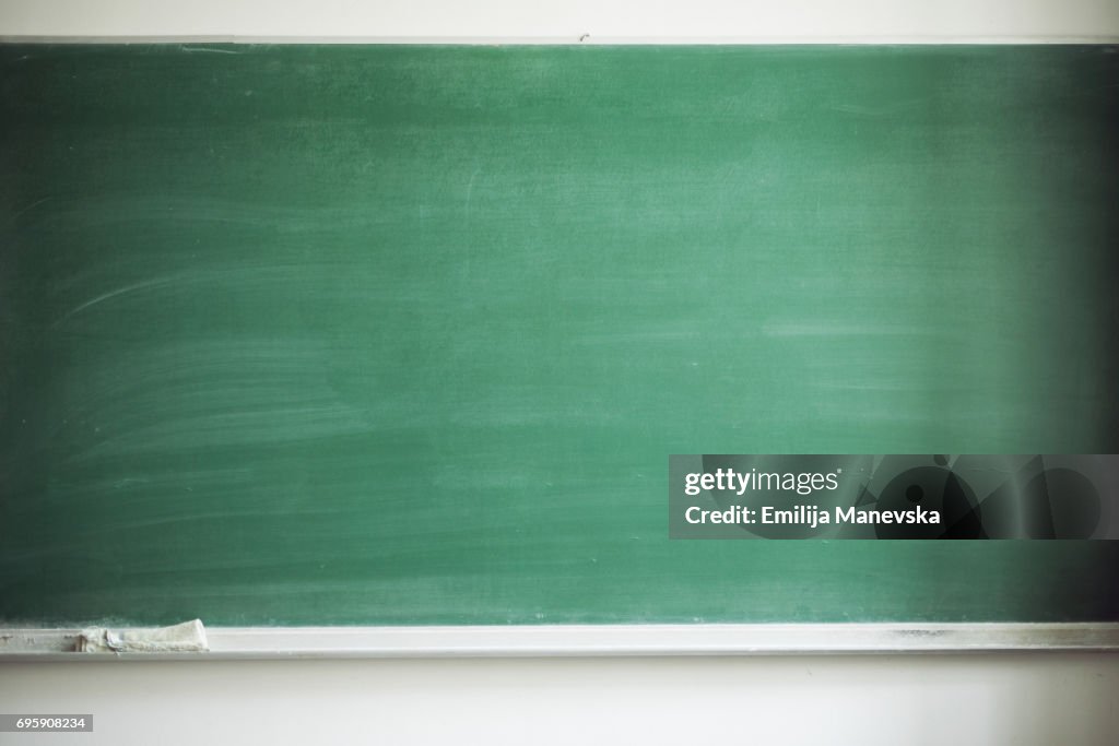 Blank blackboard with board eraser