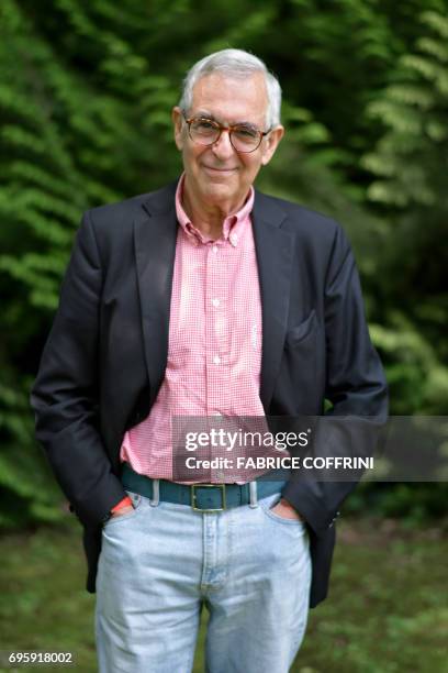French-speaking Swiss writer Metin Arditi poses at his home in Geneva on June 14, 2017. - Arditi on June 7, 2017 received the Mediterranean Prize , a...
