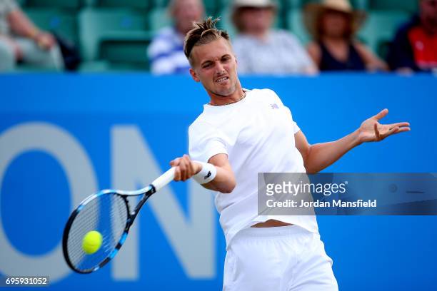 Lloyd Glasspool of Great Britain plays a forehand during his Men's singles second round match against Marc Polmans of Australia during day three of...