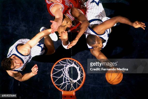Dennis Scott of the Orlando Magic shoots against the Chicago Bulls during a game played on February 26, 1995 at Orlando Arena in Orlando, Florida....