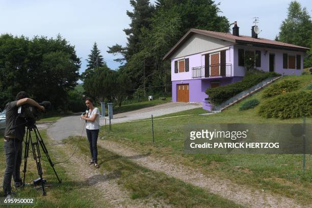 Journalists work in Aumontzey, on June 14 in front of Marcel and Jacqueline Jacob's house, on the day they were placed in custody over Gregory...