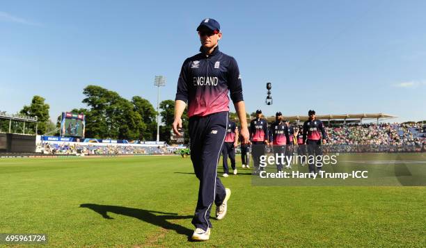 Eoin Morgan of England walks off the pitch after his sides defeat during the ICC Champions Trophy Semi Final match between England and Pakistan at...